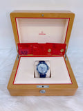 Omega watch in a wooden box with red interior