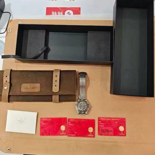 Watch and brown leather case on a display stand with Omega branding.